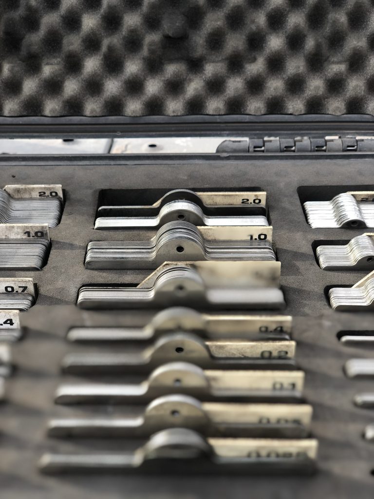 Box full of numbered metal tags